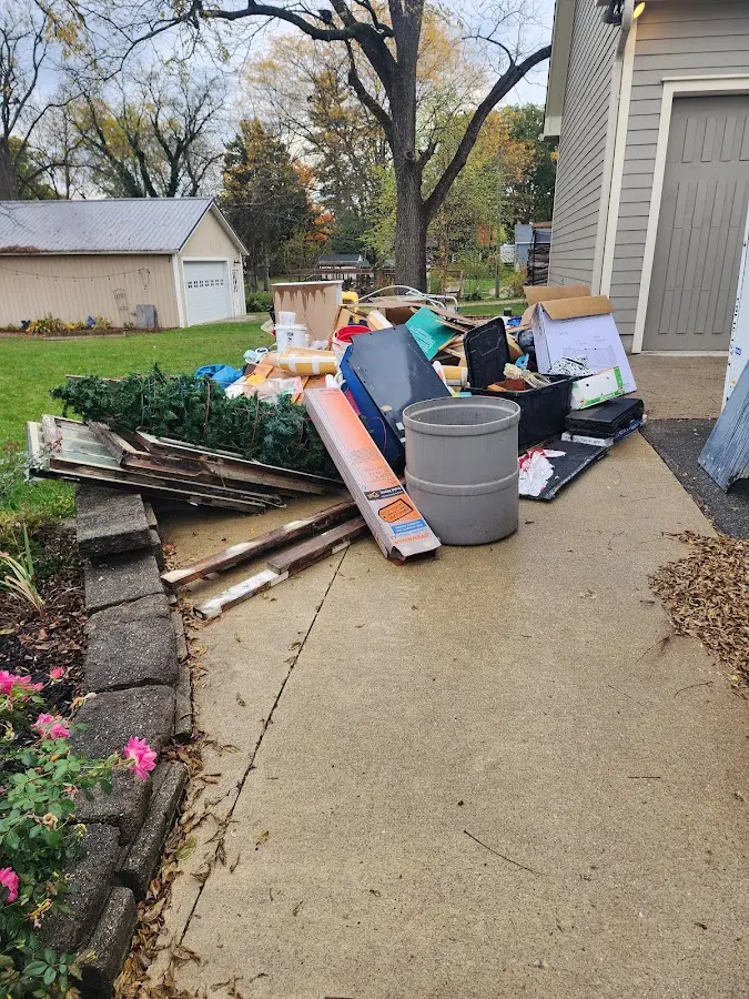 Dumpster being loaded with debris for Demolition Dumpster Rental in Vermilion